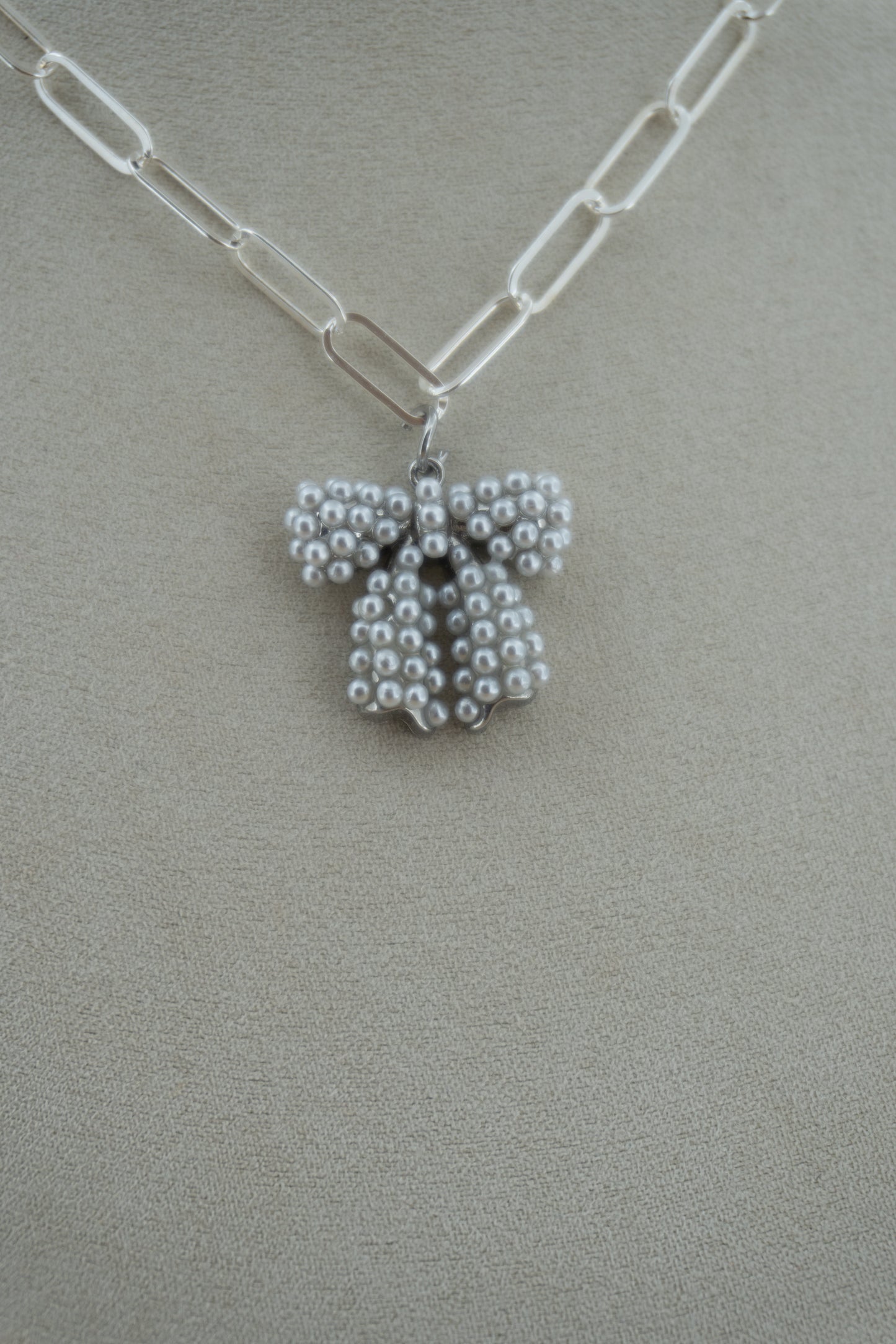 pearl bow (!!) silver charm