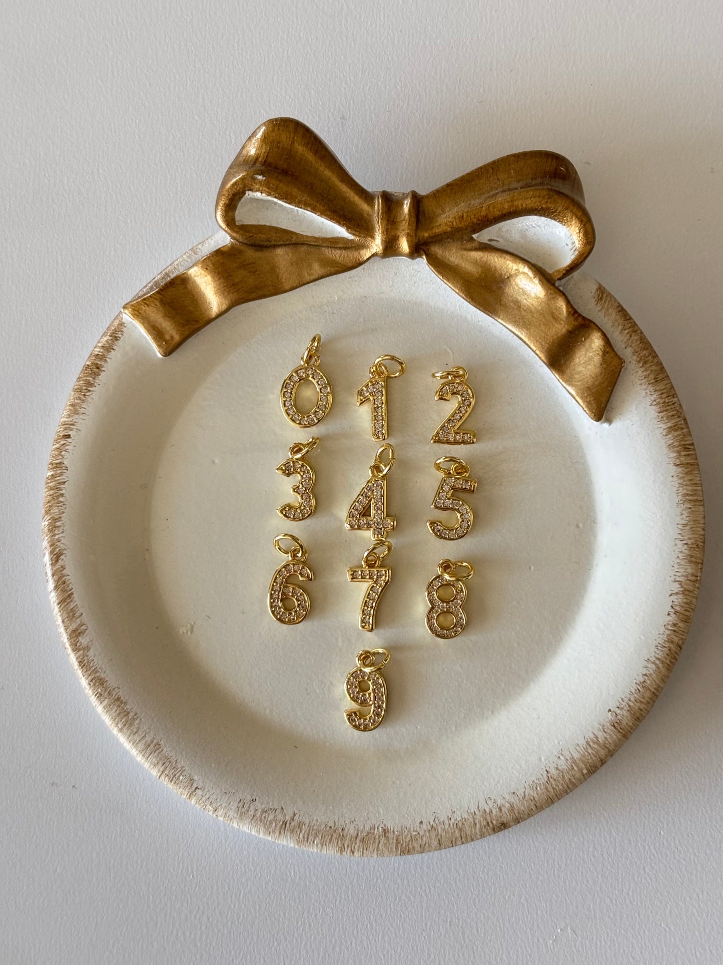 number charm in gold (slightly bigger)