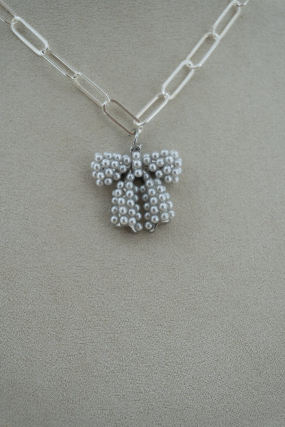 pearl bow (!!) silver charm
