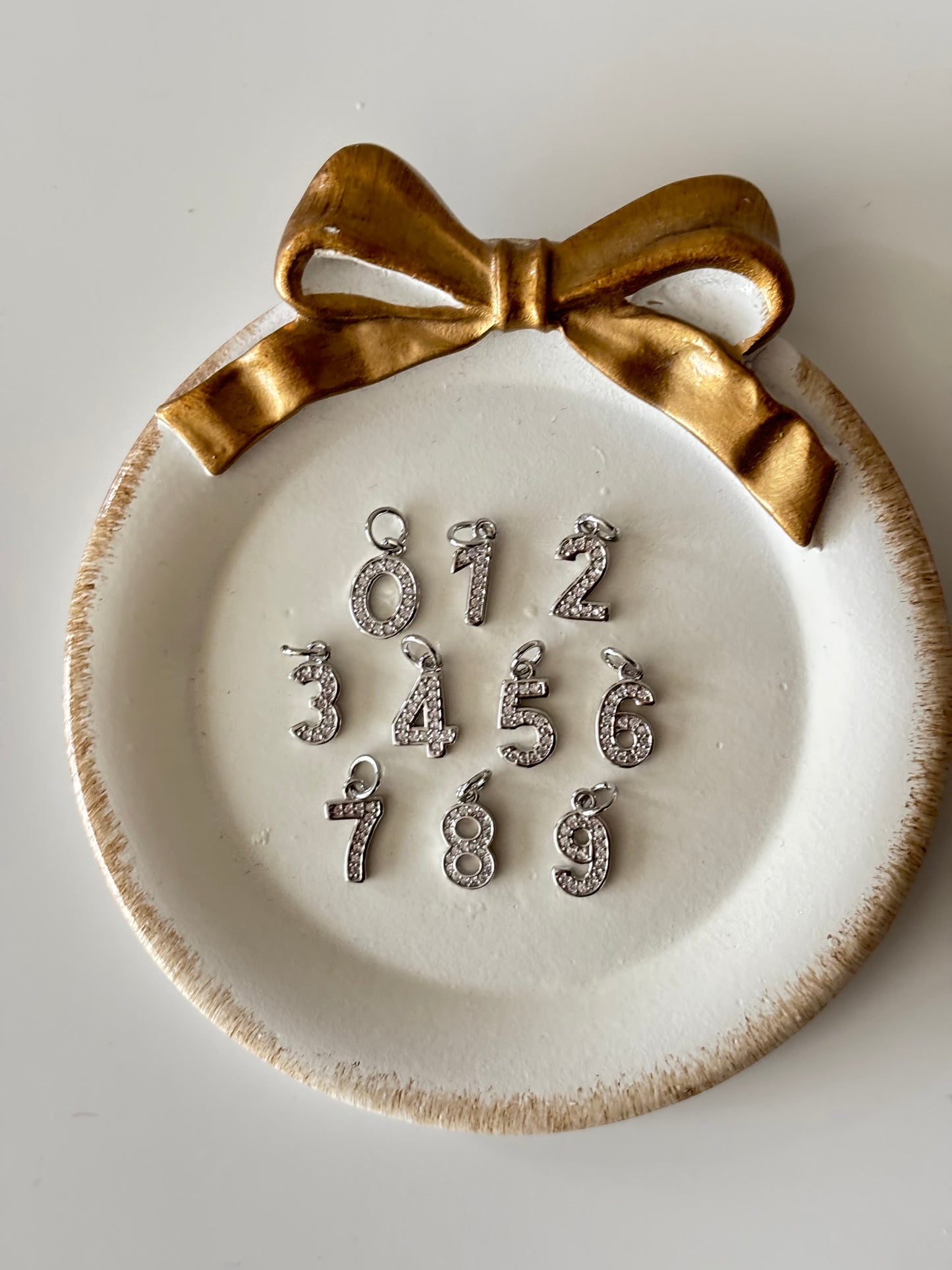 number charm in silver (slightly bigger)